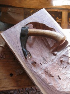 Along the long axis, I cut a channel from the rim to the trench, then continue that procedure to the left side rim.