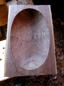 Adze work complete.  The bottom of the trench is still visible here and there.  All will be cleaned up with gouge paring after hewing the outside and drying.