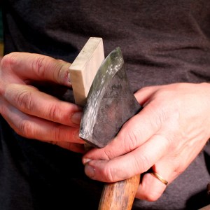 ...then tilted forward until it just touches the sharp edge.