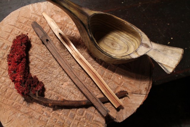 The berry clusters of sumac stand out in late summer and long after the leaves have dropped. A friend of mind found dozens of old sumac spiles in an old collapsed sugar shack. The one on the left is one of those; the one on the right is one I made a few years ago as an experiment. The pith is wide and soft, allowing for a natural tube and trough. On the far right is the roughed out sumac bowl, drying and waiting for the final carving stages.
