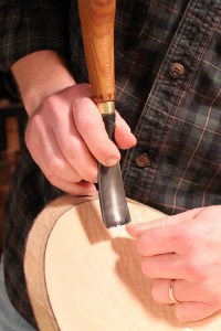 ...and slide the tool forward with the lightest pressure along the edge of the thumbnail. Obviously, avoid contact with any skin in front of the nail.